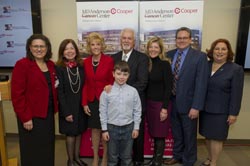 From left: Generosa Grana, MD, director, MD Anderson at Cooper; Adrienne Kirby, PhD, FACHE, president and chief executive officer of Cooper University Health Care; Linda Rohrer, President of the Rohrer Foundation; Ed Warner; Griffin Clarke (front center); Stacey Clarke; Chapman Vail; and Susan Bass Levin, president and chief executive officer of The Cooper Foundation.